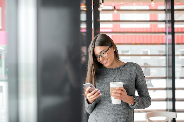 using-mobile-woman-tablet-cafe